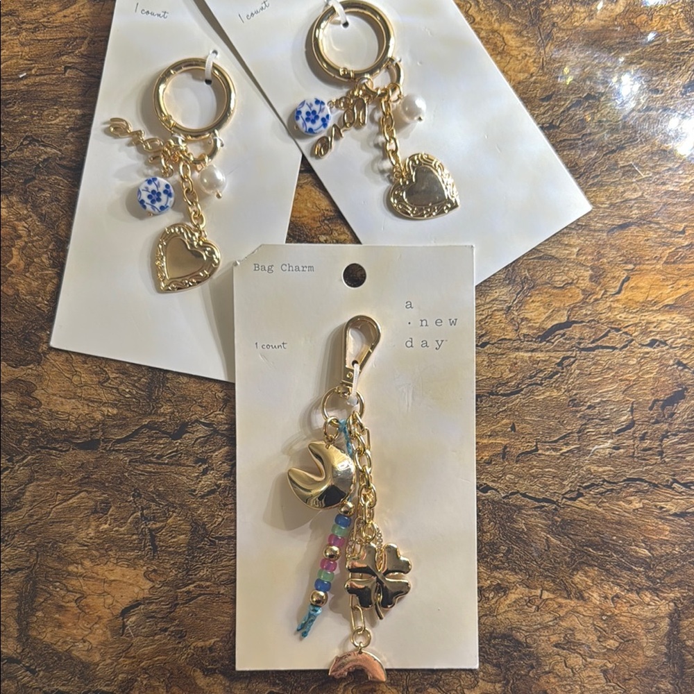 A New Day Gold keychains / bag charms pick one - Picture 1 of 4
